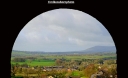 Framed view of Lancashire's Ribble valley from Clitheroe castle