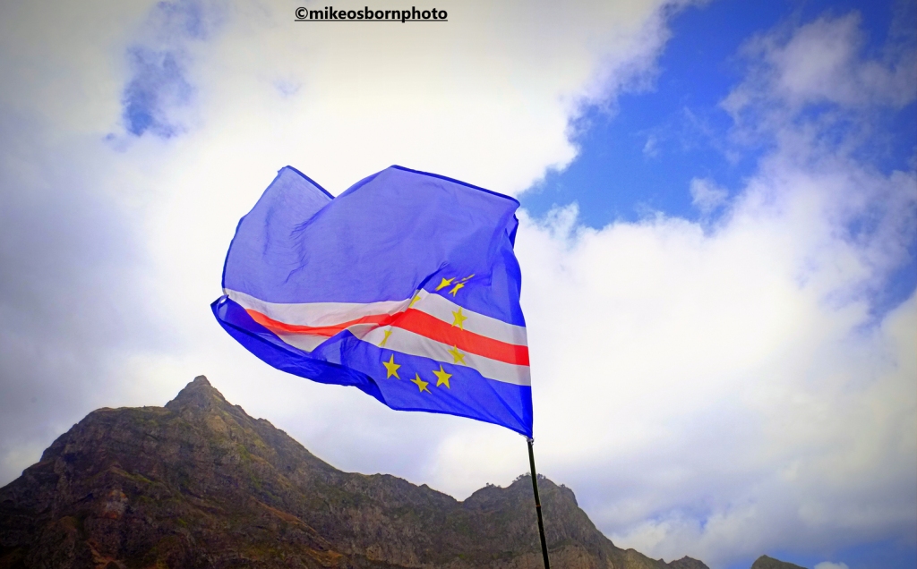 The Cape Verde flag flutters over the mountains of Santo Antão in Cape Verde