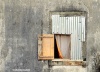 A makeshift window on a disused plantation building in São Tomé, still used as shelter by local people.